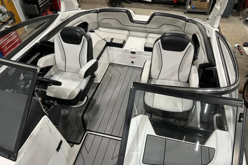 Slide: The Image of 2019 Yamaha Boats 212X interior with sleek seating and modern design. - 12