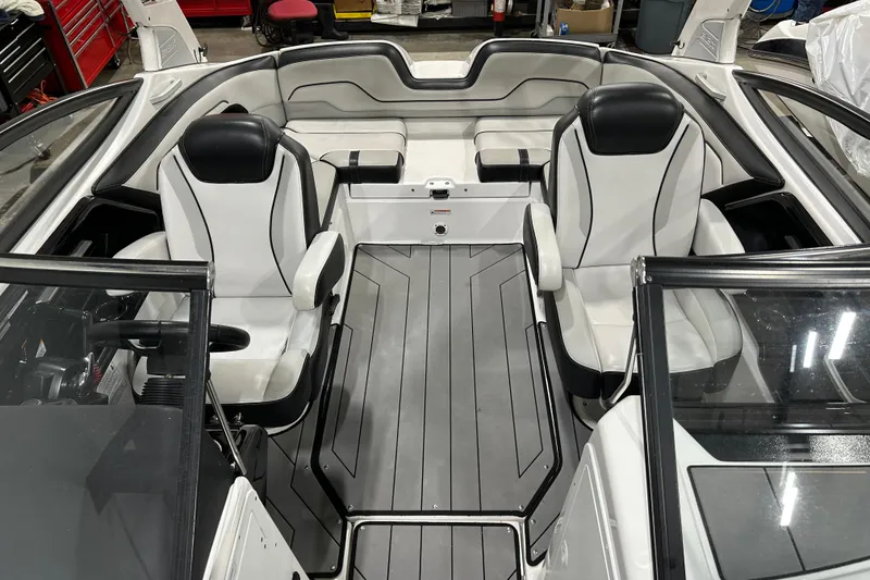 Slide: The Image of 2019 Yamaha Boats 212X interior with sleek seating and modern design. - 13