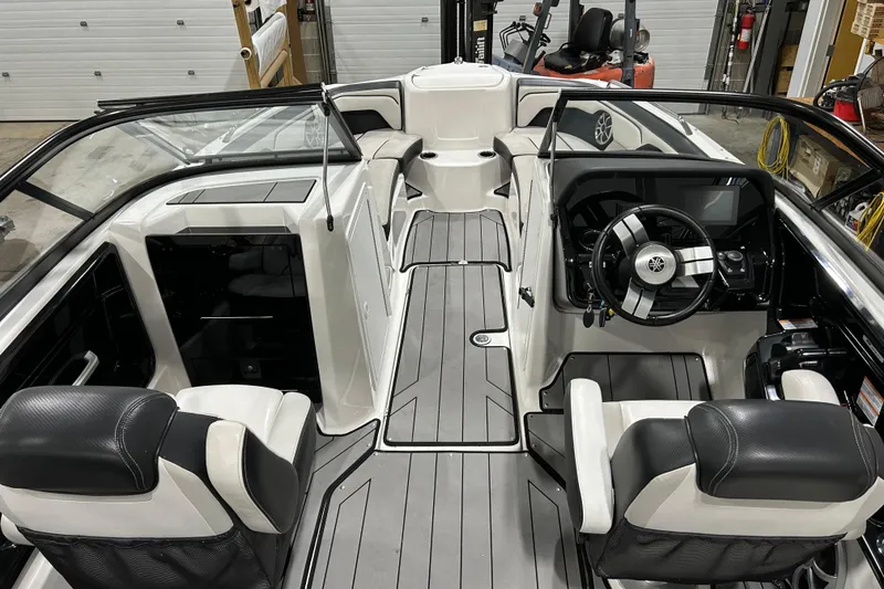 Slide: The Image of 2019 Yamaha Boats 212X interior with sleek seating and modern dashboard design. - 14