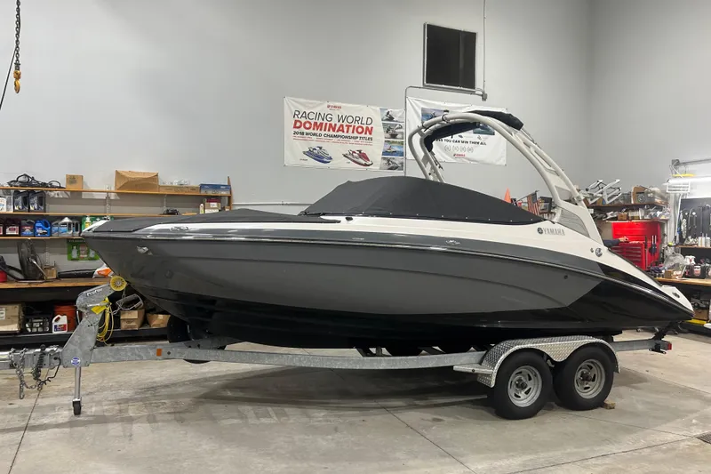 Slide: The Image of 2019 Yamaha Boats 212X on trailer in a garage setting. - 6