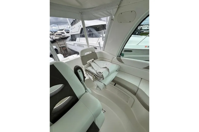 Slide: The Image of Boston Whaler 345 Conquest 2010 boat engine area with cables and equipment. - 14