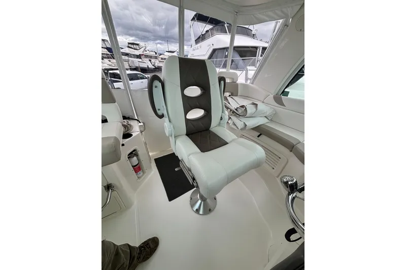 Slide: The Image of 2010 Boston Whaler 345 Conquest with triple Mercury outboard engines at marina. - 16