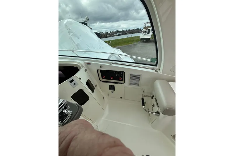Slide: The Image of Helm of 2010 Boston Whaler 345 Conquest with advanced navigation systems and controls. - 18