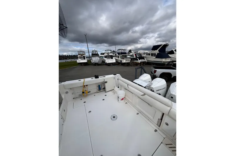 Slide: The Image of Captain's chair on 2010 Boston Whaler 345 Conquest boat, featuring sleek design and comfort. - 22