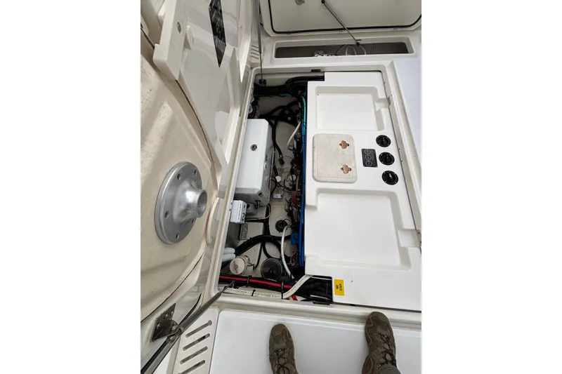 Slide: The Image of 2010 Boston Whaler 345 Conquest boat with Mercury engines, docked under cloudy skies. - 25