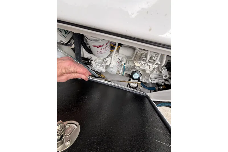 Slide: The Image of 2010 Boston Whaler 345 Conquest boat docked with cloudy sky background. - 27