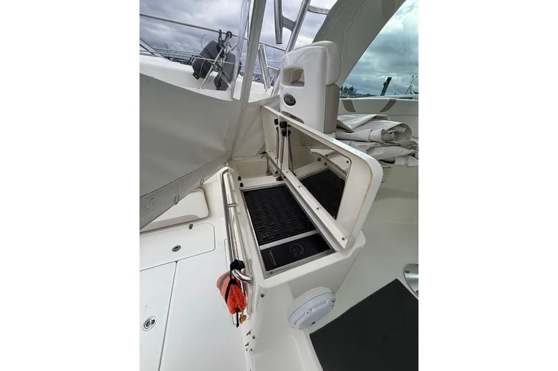 Slide: The Image of Engine compartment of a 2010 Boston Whaler 345 Conquest boat, showing mechanical components. - 31