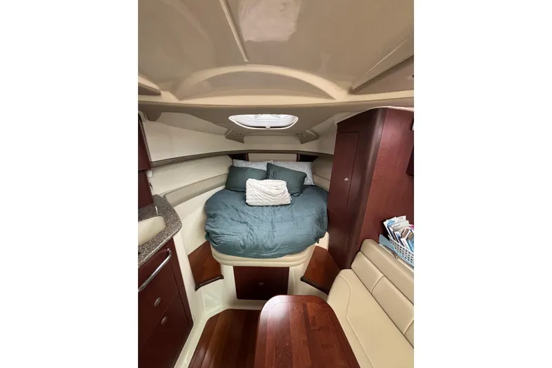 Slide: The Image of Interior view of a 2010 Boston Whaler 345 Conquest boat, featuring storage and equipment. - 35