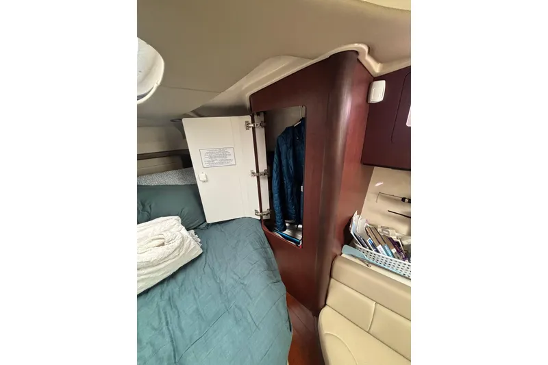 Slide: The Image of 2010 Boston Whaler 345 Conquest boat interior with open storage compartment. - 36