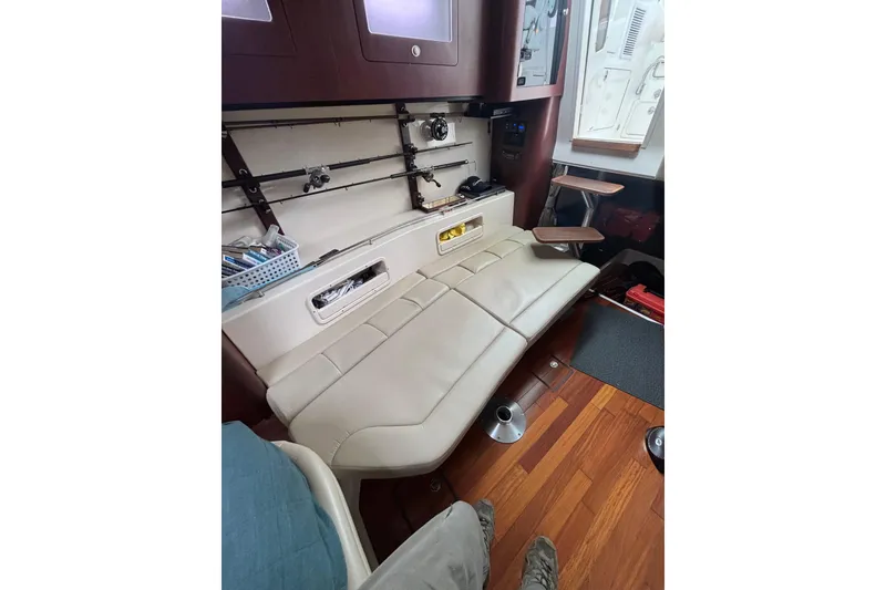 Slide: The Image of Interior view of a 2010 Boston Whaler 345 Conquest boat, featuring seating and speaker. - 39