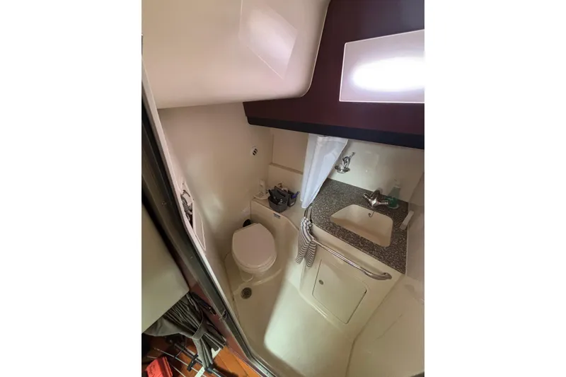 Slide: The Image of Interior cabin of 2010 Boston Whaler 345 Conquest with cozy bed and seating area. - 40