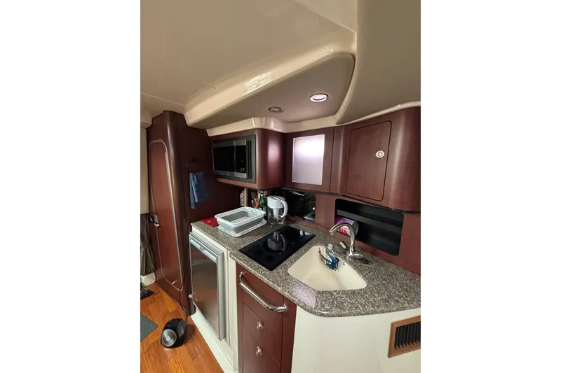 Slide: The Image of Interior of 2010 Boston Whaler 345 Conquest with seating and fishing rod storage. - 42