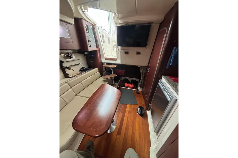 Slide: The Image of Interior of 2010 Boston Whaler 345 Conquest with seating and fishing rod storage. - 44