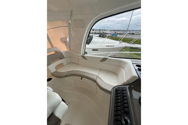 Slide: The Image of Interior of 2010 Boston Whaler 345 Conquest boat with seating, table, and TV. - 46