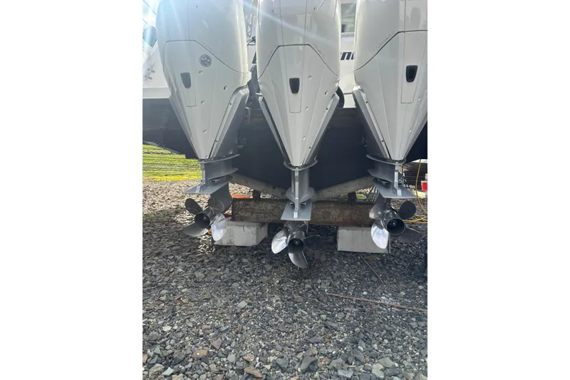 Slide: The Image of 2010 Boston Whaler 345 Conquest boat exterior under cloudy sky. - 7