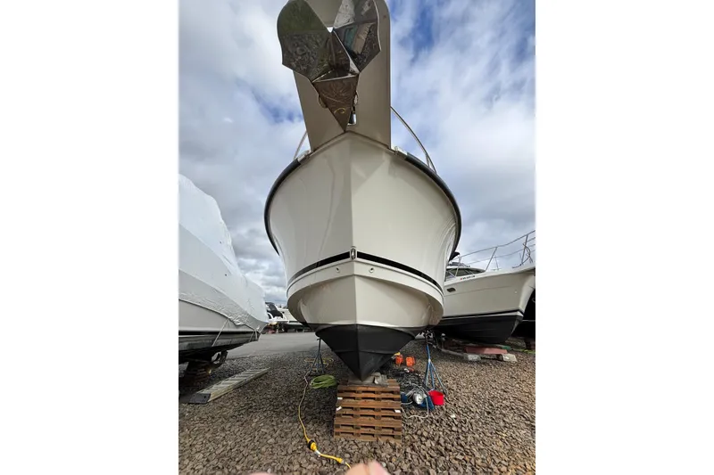 Slide: The Image of 2010 Boston Whaler 345 Conquest boat docked under cloudy skies. - 8