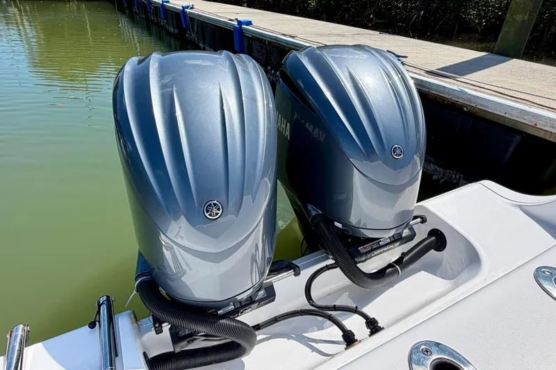 Slide: The Image of Twin Yamaha outboard engines on a 2021 Sportsman Open 302 Center Console boat. - 17