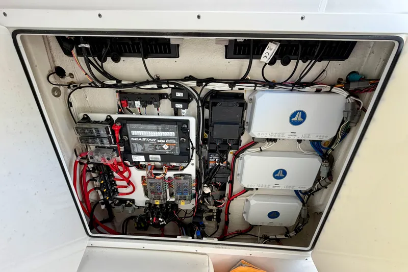 Slide: The Image of 2021 Sportsman Open 302 Center Console electrical panel with wiring and components. - 19