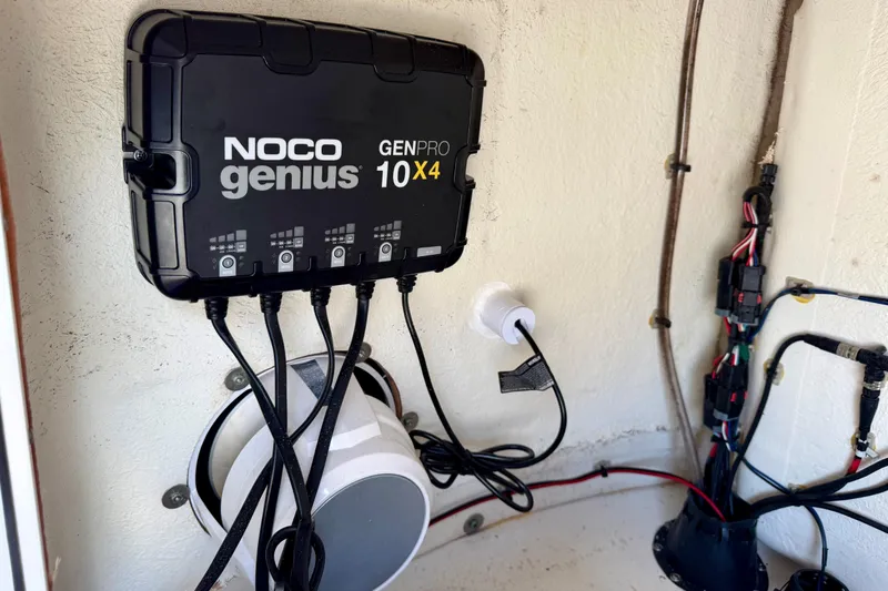 Slide: The Image of NOCO Genius GENPRO 10x4 charger installed on 2021 Sportsman Open 302 Center Console boat. - 20