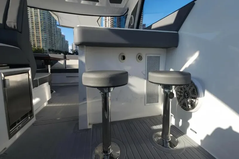 Slide: The Image of Interior of 2021 Cruisers Yachts 42 GLS OB with bar stools and modern design. - 16