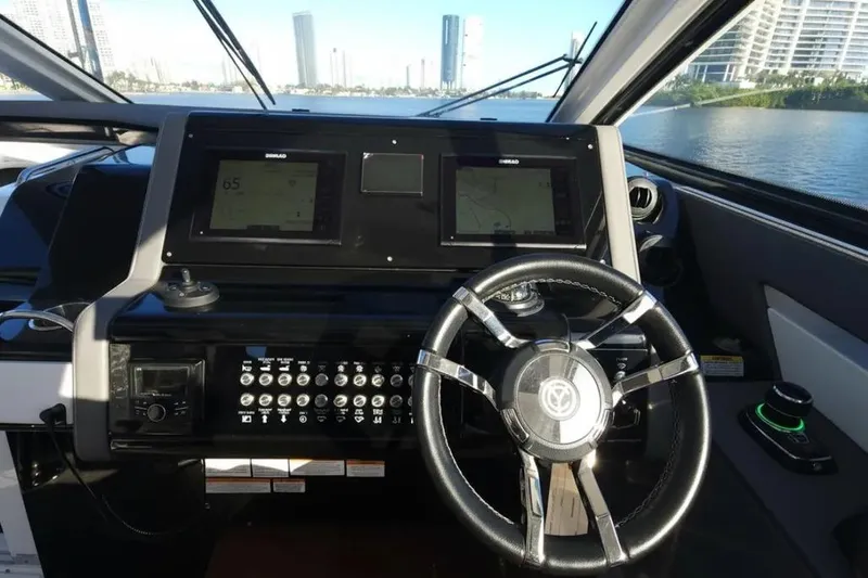 Slide: The Image of Cockpit of 2021 Cruisers Yachts 42 GLS OB with dual displays and modern steering wheel. - 20