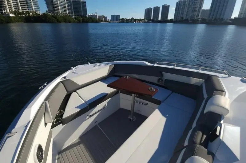 Slide: The Image of 2021 Cruisers Yachts 42 GLS OB with spacious seating and table on calm water. - 23
