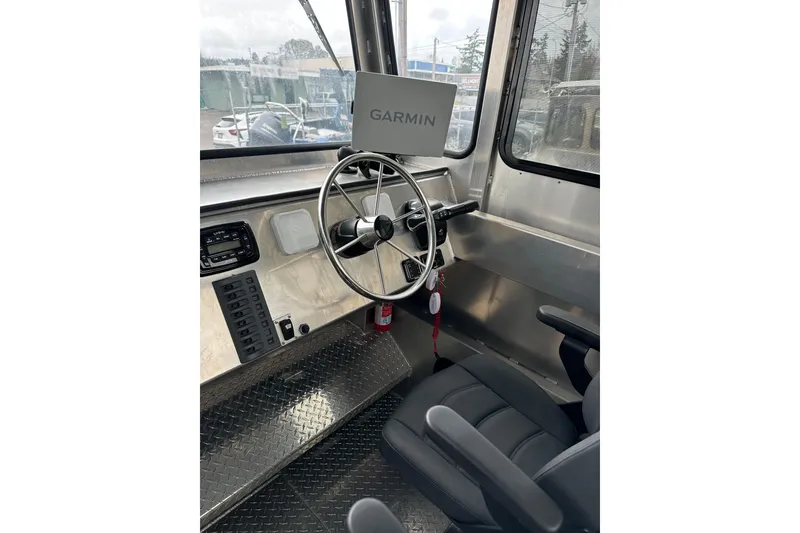 Slide: The Image of Interior of 2026 Bayview Boats 30 Landing Craft with Garmin navigation system and steering wheel. - 10