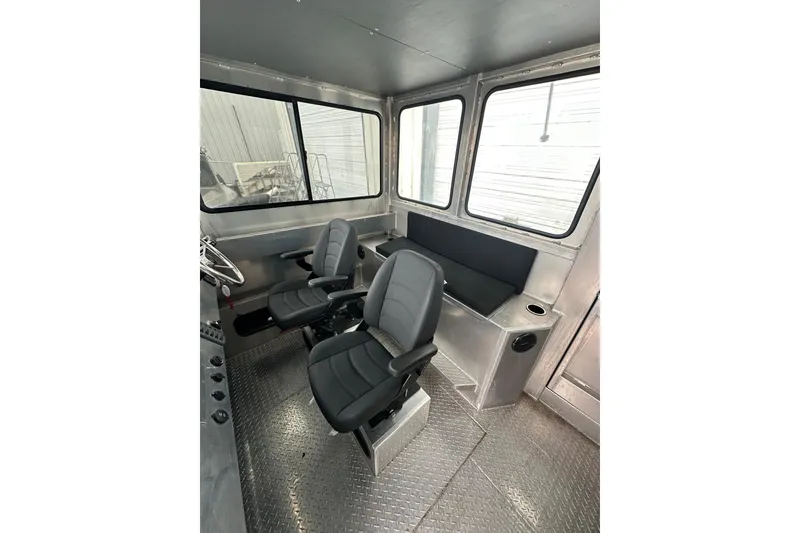Slide: The Image of Interior of 2026 Bayview Boats 30 Landing Craft with seating and control area. - 12