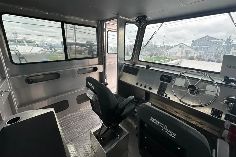 Slide: The Image of Interior of 2026 Bayview Boats 30 Landing Craft with steering wheel and control panel. - 13