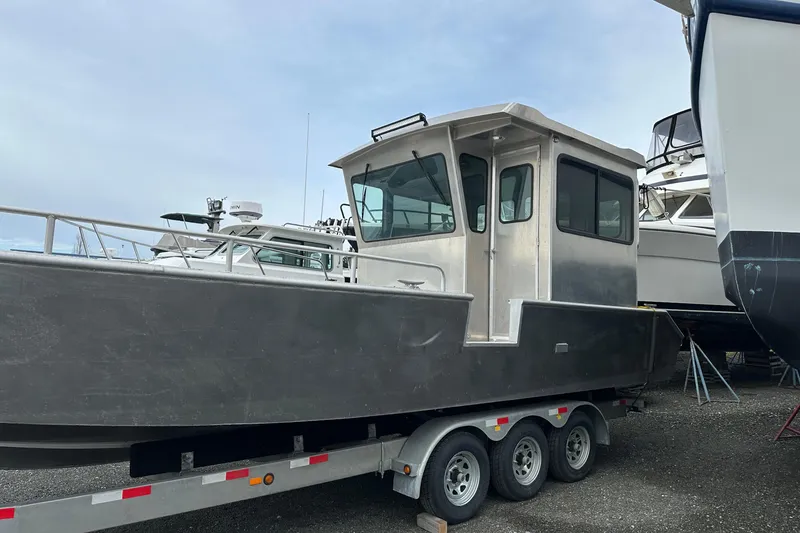 Slide: The Image of 2026 Bayview Boats 30 Landing Craft on trailer, parked outdoors. - 2