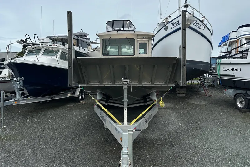 Slide: The Image of 2026 Bayview Boats 30 Landing Craft on trailer, surrounded by other boats in a marina. - 4