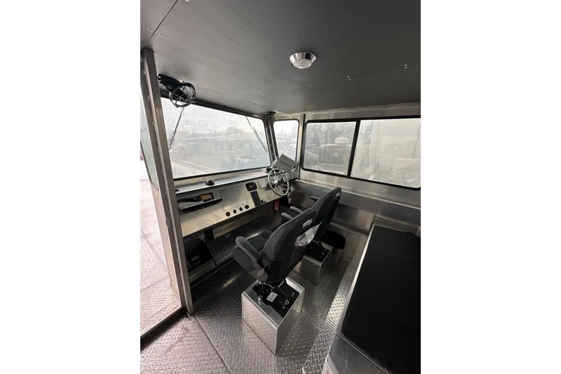 Slide: The Image of Interior of 2026 Bayview Boats 30 Landing Craft, featuring modern helm and seating. - 6