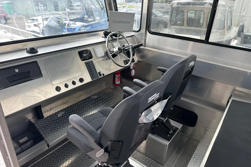 Slide: The Image of Interior of 2026 Bayview Boats 30 Landing Craft with steering wheel and control panel. - 8
