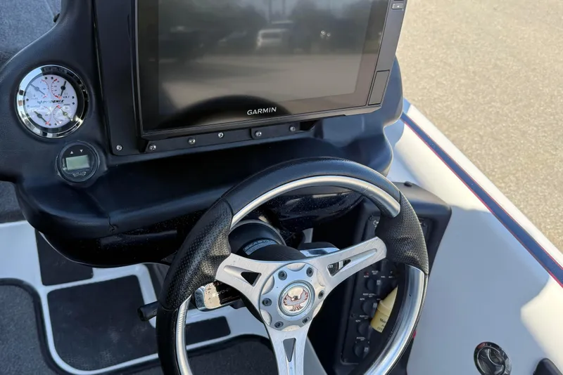 Slide: The Image of 2017 Phoenix 721 ProXP dashboard with Garmin display and steering wheel. - 12