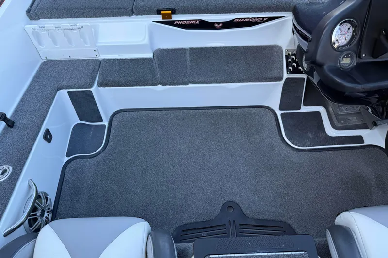 Slide: The Image of 2017 Phoenix 721 ProXP boat interior with gray carpet and seating. - 15
