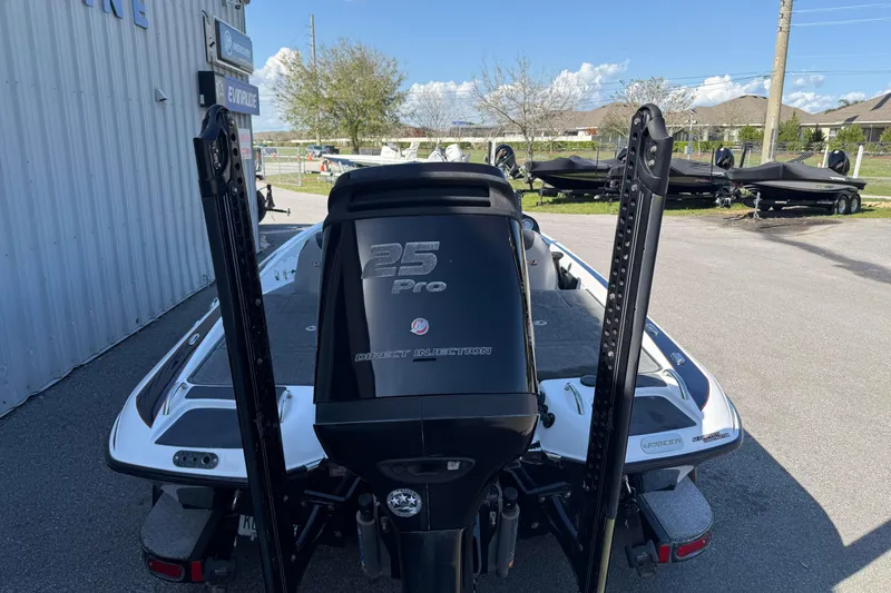 Slide: The Image of 2017 Phoenix 721 ProXP boat with 25 Pro engine, parked outdoors. - 4