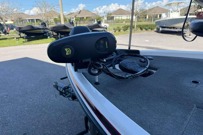 Slide: The Image of 2017 Phoenix 721 ProXP boat with trolling motor, parked outdoors on a sunny day. - 7