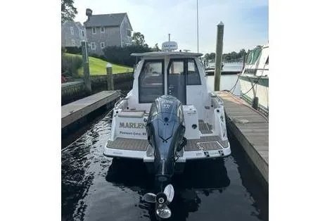 Slide: The Image of 2022 Cutwater C-24 Coupe boat docked at harbor. - 13
