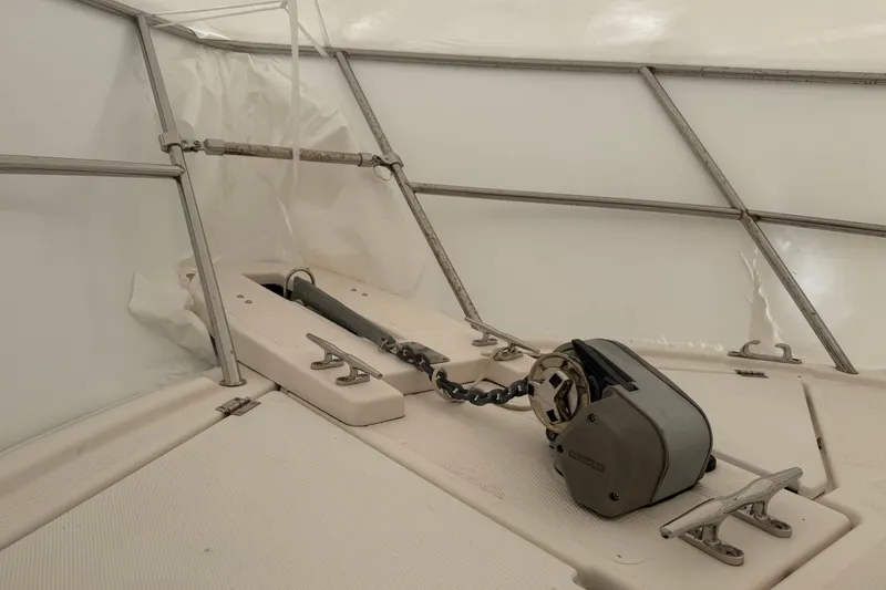 Slide: The Image of 2022 Cutwater C-24 Coupe boat interior with anchor chain and winch system. - 24