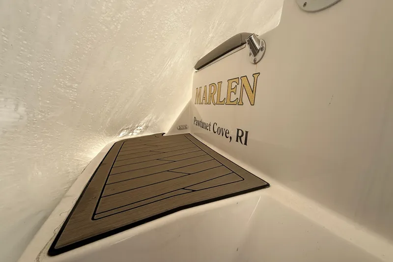 Slide: The Image of 2022 Cutwater C-24 Coupe boat with teak deck, named "MARLEN," Pawtuxet Cove, RI. - 25