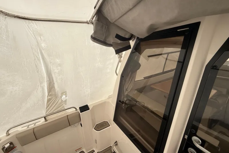 Slide: The Image of 2022 Cutwater C-24 Coupe interior with seating and window view. - 28