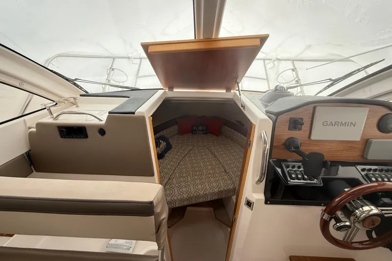 Slide: The Image of Interior of 2022 Cutwater C-24 Coupe boat with Garmin navigation system. - 45