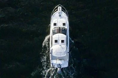 Slide: The Image of Manufacturer Provided Image: Aerial view of 2022 Cutwater C-24 Coupe boat cruising on water. - 5