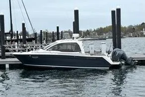 Slide: The Image of 2022 Cutwater C-24 Coupe at dock, sleek design. - 6