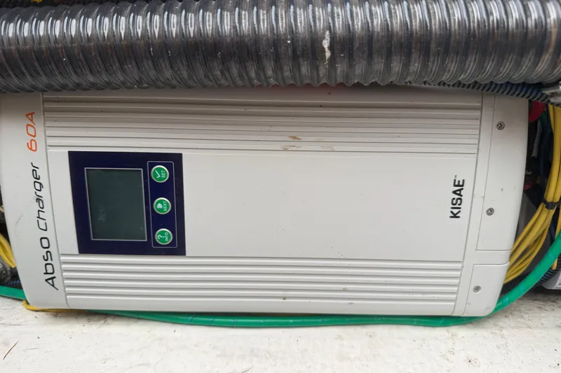 Slide: The Image of KISAE Abso Charger 60A installed in a 2022 Cutwater C-24 Coupe boat. - 62