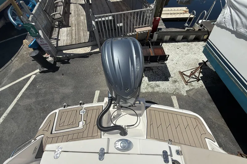 Slide: The Image of 2022 Cutwater C-24 Coupe boat with outboard motor at dockside view. - 68