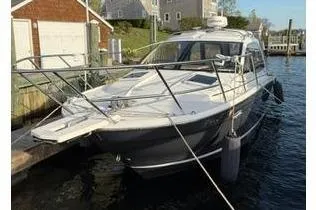 Slide: The Image of 2022 Cutwater C-24 Coupe docked on a sunny day. - 8