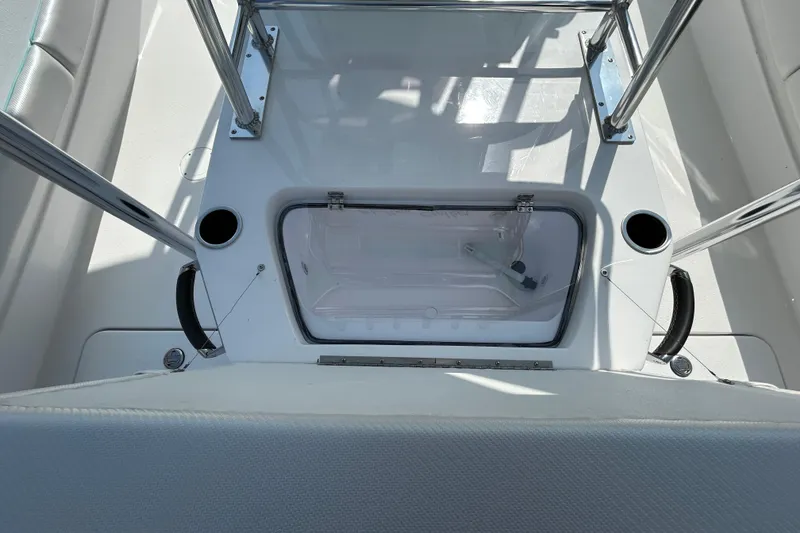 Slide: The Image of 2026 Shallow Stalker The Boss boat interior with storage compartment and cup holders. - 11