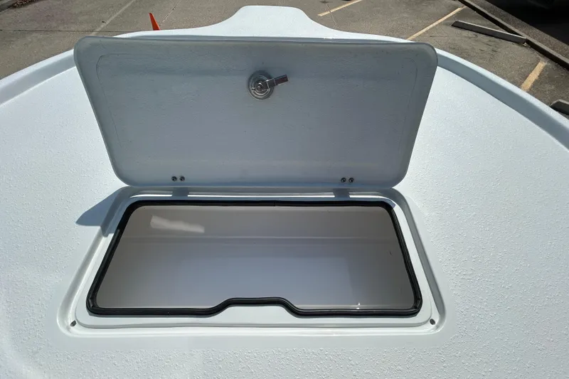 Slide: The Image of Open storage compartment on 2026 Shallow Stalker The Boss boat deck. - 16