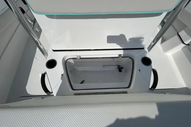 Slide: The Image of 2026 Shallow Stalker The Boss boat interior with open storage compartment. - 17